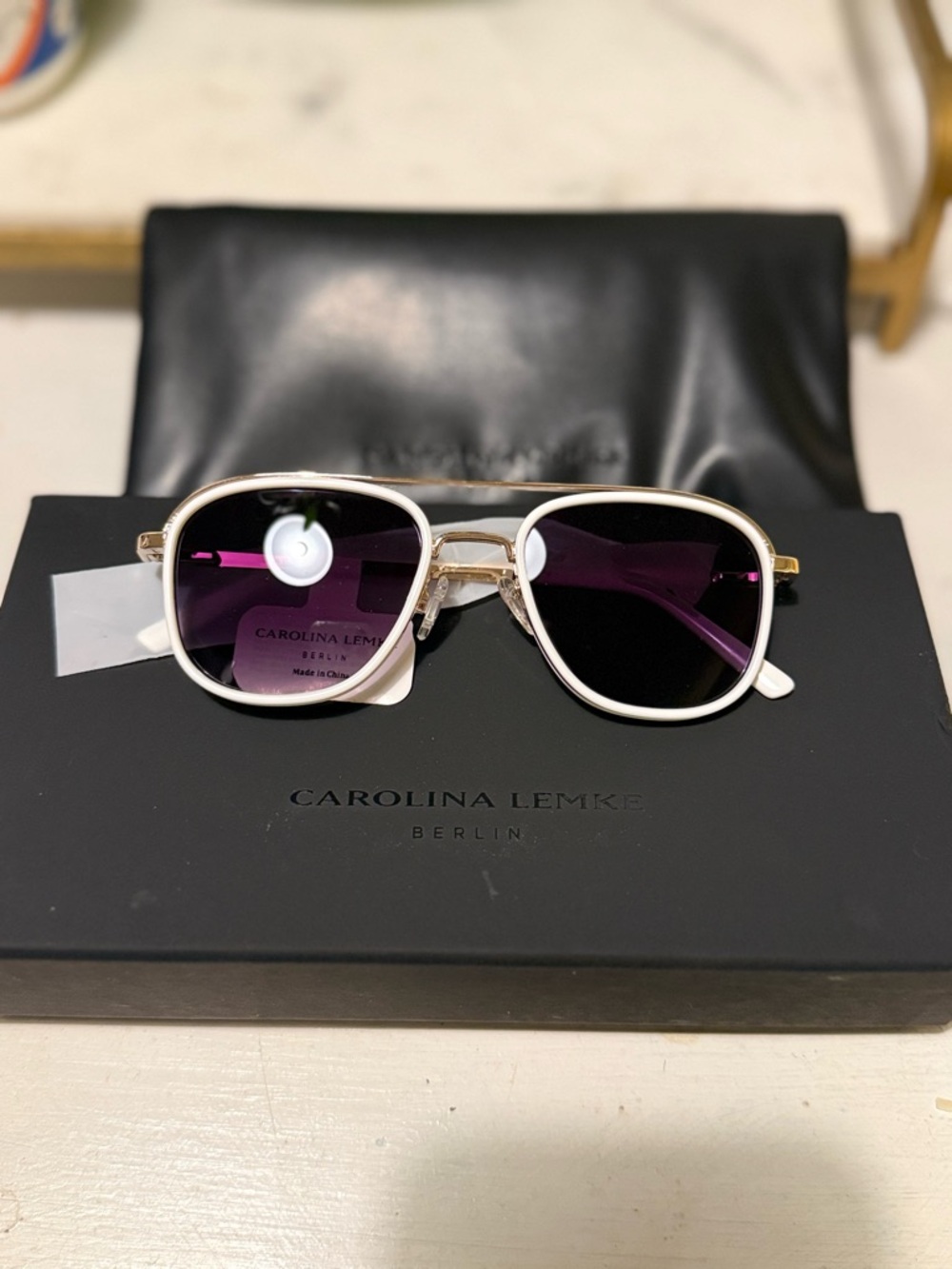 Brand new Carolina Lemke White and gold Frame Sunglasses with Purple Lenses